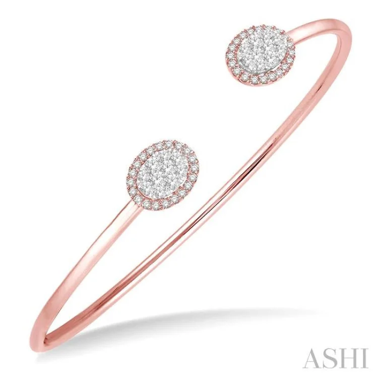 5/8 Ctw Oval Shape Lovebright Open Cuff Diamond Bangle in 14K Rose and White Gold